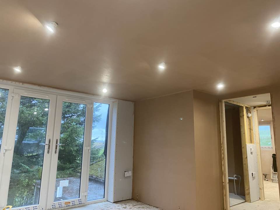 Freshly plastered living room with garden view in Dundee