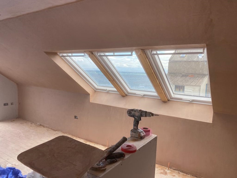 Plastered loft conversion with skylights and sea view in Dundee